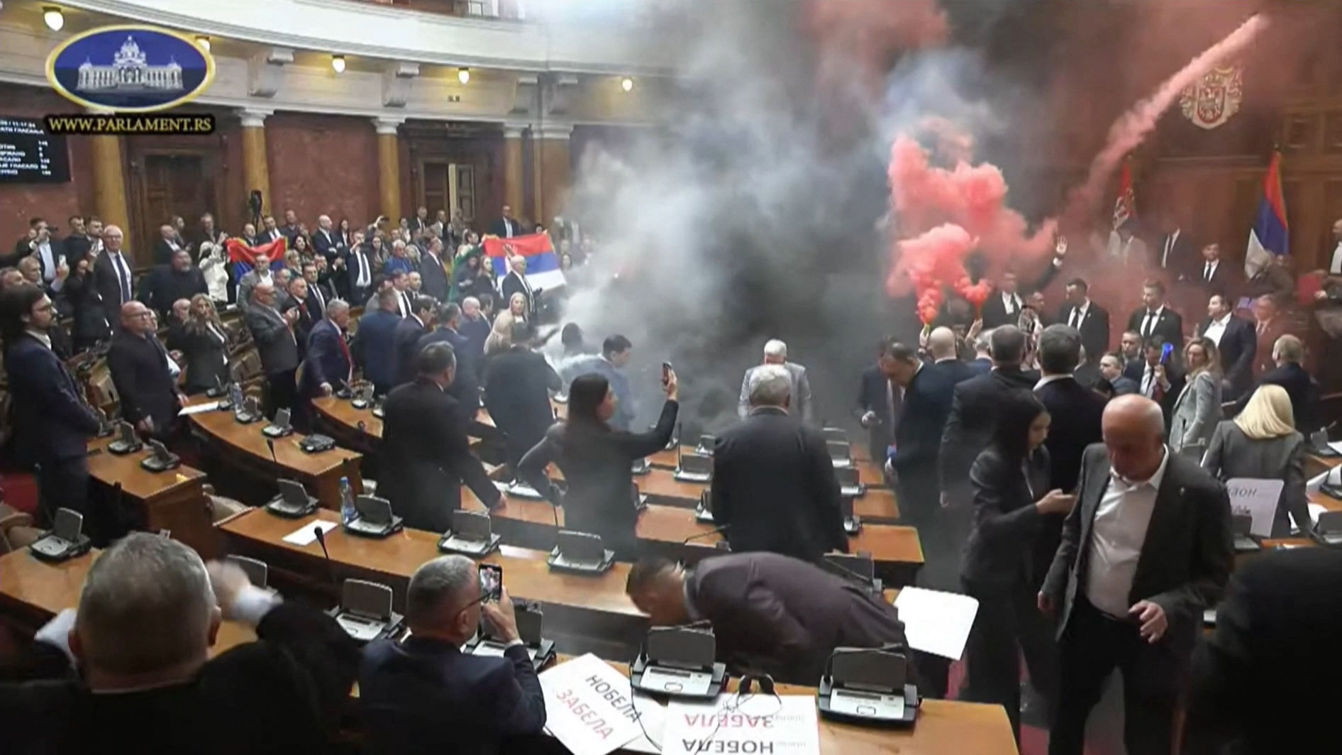 Serbia opposition disrupts parliament with flares, smoke to support protests